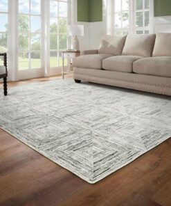 Geometric patterned rug in gray and cream tones